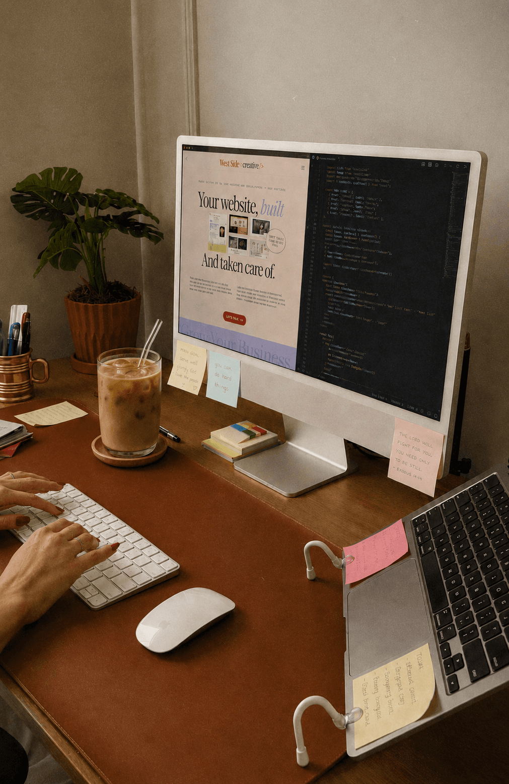 laptop on a desk with a website open and a code screen open